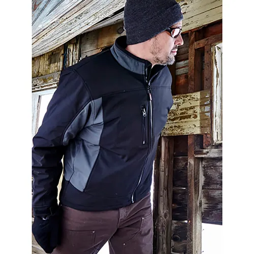 Man in black jacket and beanie by window
