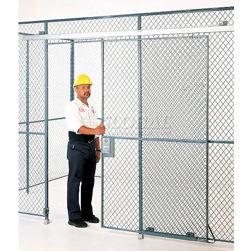 Worker with hard hat opening chain-link cage