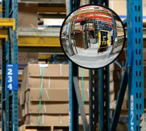 Convex mirror reflecting warehouse pallets and racks