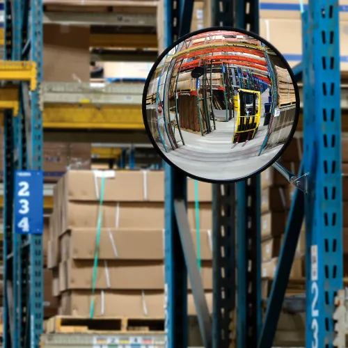Convex mirror reflecting warehouse pallets and racks