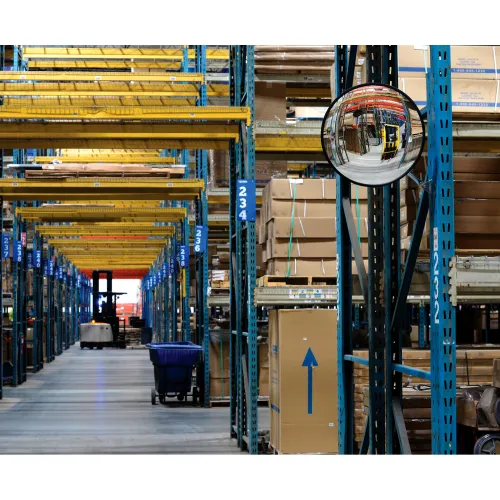 Warehouse shelves and stacked boxes with safety mirror