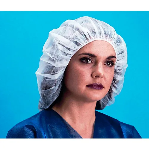Medical professional in surgical cap and scrubs