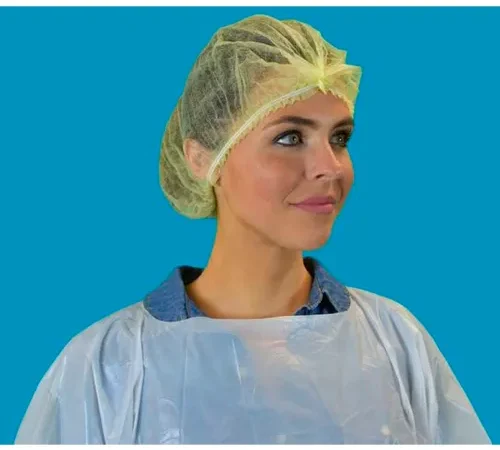 Healthcare worker wearing yellow bouffant cap