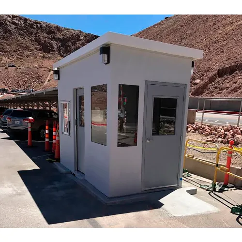 White security booth with parking and mountains