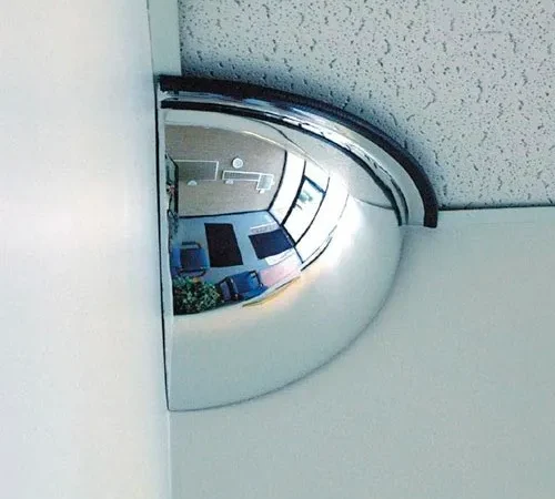 Convex corner mirror reflecting office interior