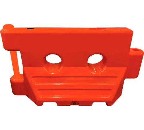 Bright orange plastic water-filled traffic barrier
