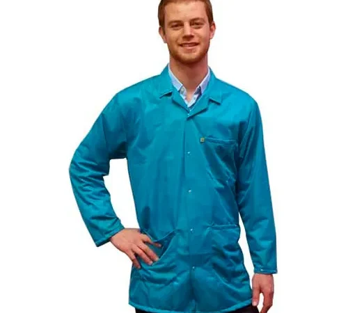 Smiling man wearing teal lab coat