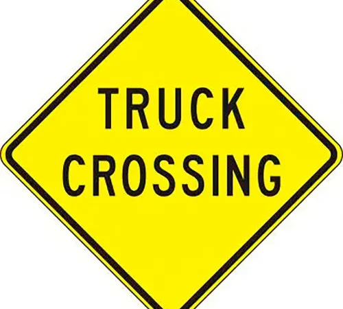 AccuformNMC Truck Crossing Traffic Sign, EGP Reflective Aluminum, 24" x 24", Black/Yellow